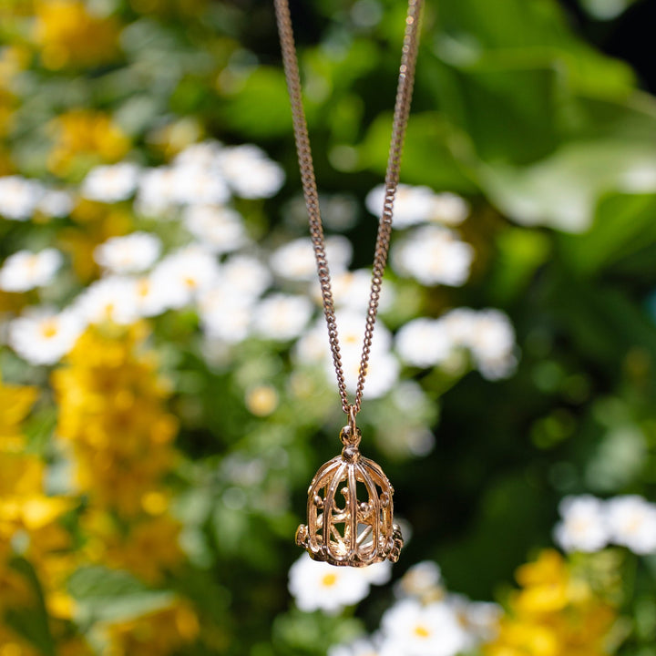 Luxurious 18ct Gold Vermeil Birdcage Necklace, a unique jewellery piece linking nature and nostalgia.