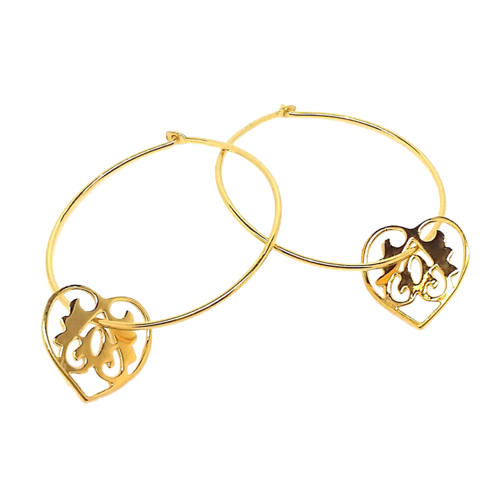 A pair of gold vermeil hoop earrings with heart designs, intended for adults.