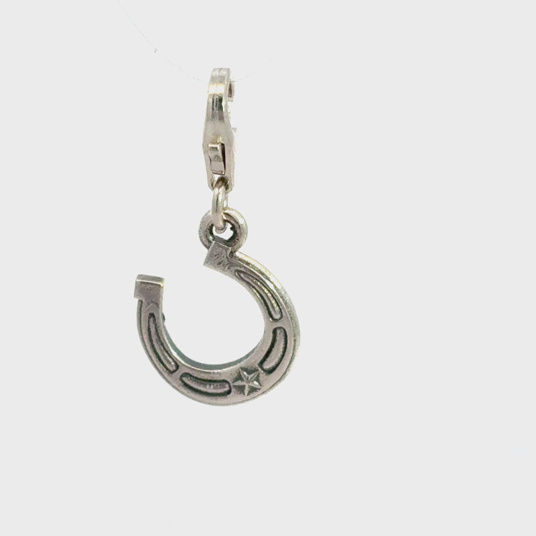 Sterling Silver lucky horseshoe clip-on charm showing charm movement and detail
