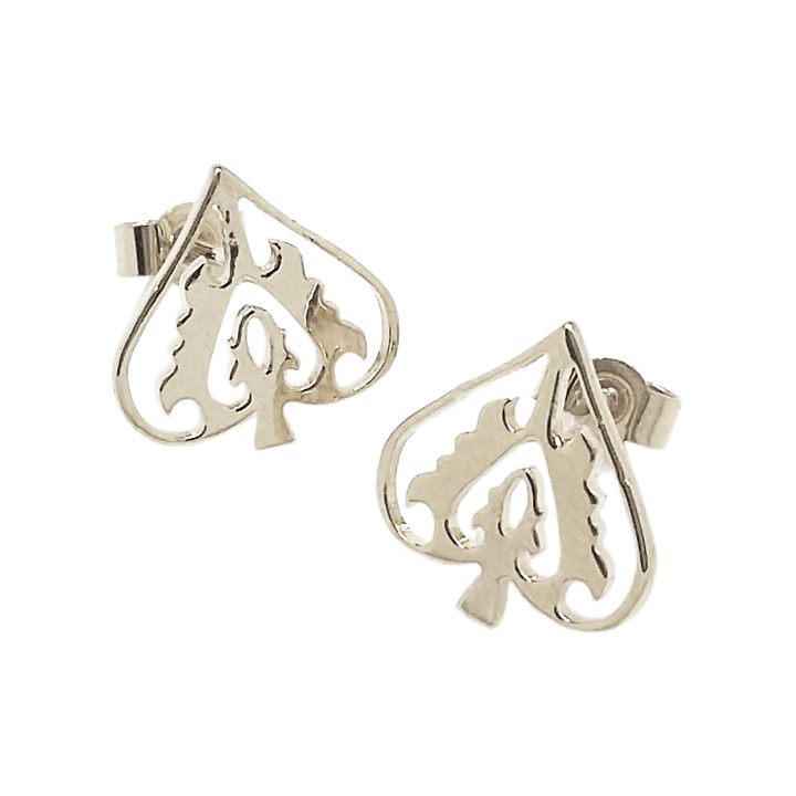 A pair of silver stud earrings designed to resemble an ace of spades, with a stylized heart inside the design representing protection.