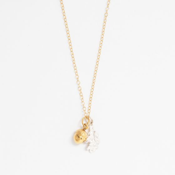 Blackbird Jewellery Oak Leaf and Acorn Necklace in sterling silver and gold vermeil on a white background – nature inspired handmade jewellery gift”