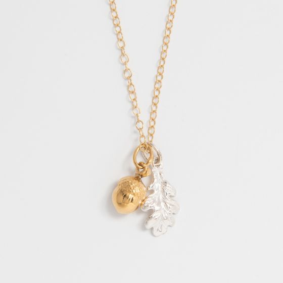 Blackbird Jewellery Close Up Oak Leaf and Acorn Necklace in sterling silver and gold vermeil on a white background – nature inspired handmade jewellery gift